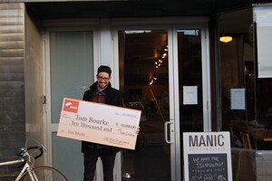 tom-with-cheque
