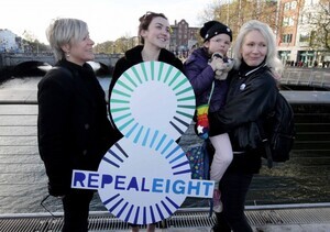 NO REPRO FEE 25/11/2016 Coalition to Repeal the Eighth Amendment hosted a Women Rising 2016 Rally today in Dublin. Pictured at the lunchtime rally ‘Women Rising in Solidarity 2016’ on Rosie Hackett Bridge, Dublin were, from left, Sarah Francis, Lucy Watmough, six-year-old Isis Pendergast and her mother Rachel. The rally was organised to demand that the Irish Government take action to respect and protect women’s lives, health and choices. Supporters were encouraged to wear black and tweet their support using #Black4Repeal. The rally is one of two Irish events that took place today (25.11.2016) as part of an international day of support for women in countries where abortion is banned or difficult to access. Some of the countries participating around the world include Brazil, Peru, Ecuador, Poland, Chile, Argentina, Mexico and Italy.  PHOTO: Mark Stedman