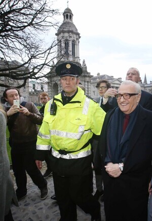 24/2/2017 Martin Scorsese in Dublin. Pictured is film director Martin Scorsese in Dublin's Trinity College today, as he is is escorted by Gardai past fans towards his awarding of a gold medal by Trinity College's Philosophical Society. Scorcese will be in Dublin this weekend for a number of events to honour his contribution to film. Photographer: Sam Boal / RollingNews.ie
