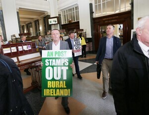 14/3/2017 Postmaster Protest. Pictured are postmasters protesting inside the GPO as members of the public go about their business. The postmasters say that they will resist any Post Office closures driven by An Post. They are also demanding publication and implementation of a Government commissioned report on the future of the Post Office Network which was finalised last year. Photograph: RollingNews.ie