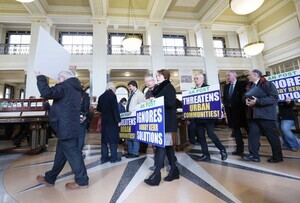 14/3/2017 Postmaster Protest. Pictured are postmasters protesting inside the GPO as members of the public go about their business. The postmasters say that they will resist any Post Office closures driven by An Post. They are also demanding publication and implementation of a Government commissioned report on the future of the Post Office Network which was finalised last year. Photograph: RollingNews.ie
